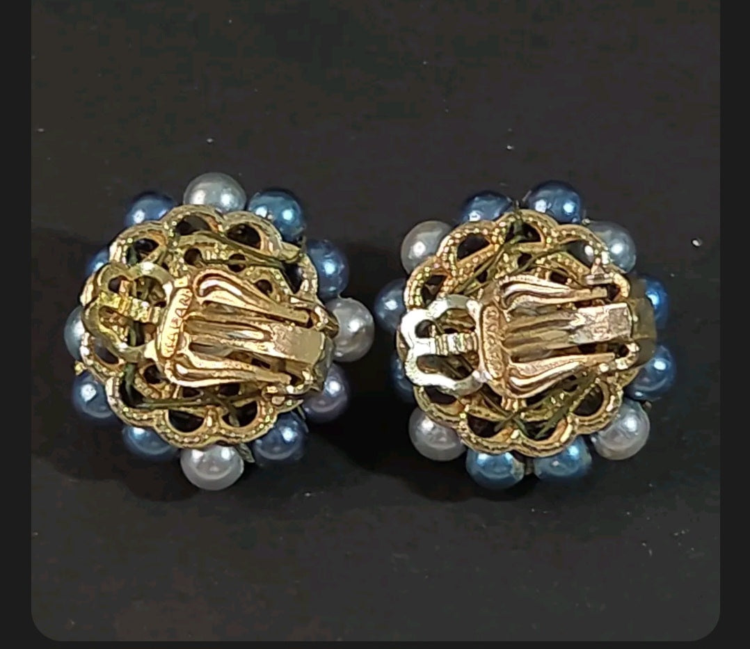 Oddly Darling Vintage mid-century clip-on earrings with blue and grey faux pearl clusters and gold-tone metal backs.