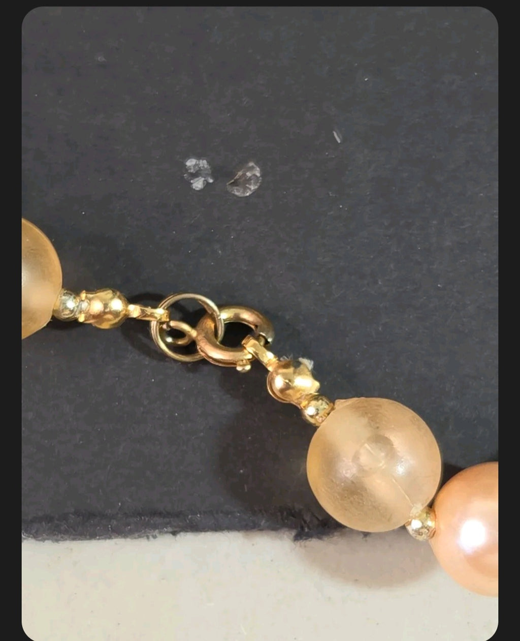 Oddly Darling Vintage necklace featuring peach faux pearls, frosted beads, and gold-tone fluted spacers with a clasp.