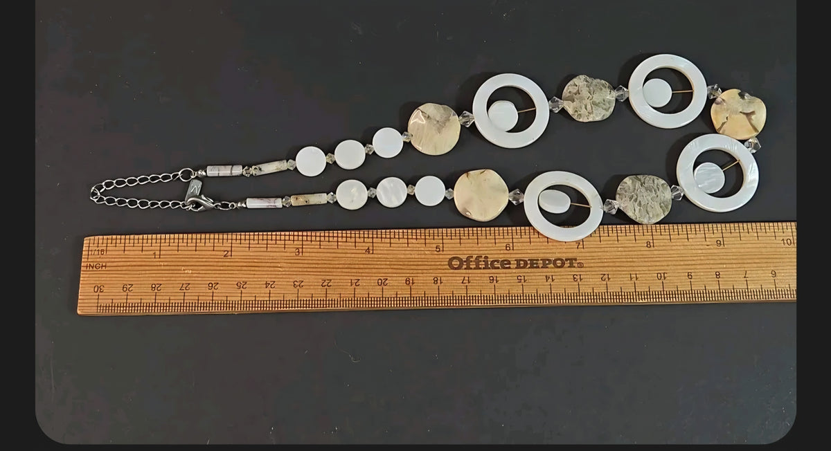 Oddly Darling Vintage artisan statement necklace with mother-of-pearl, stone beads, and crystal accents on a ruler.