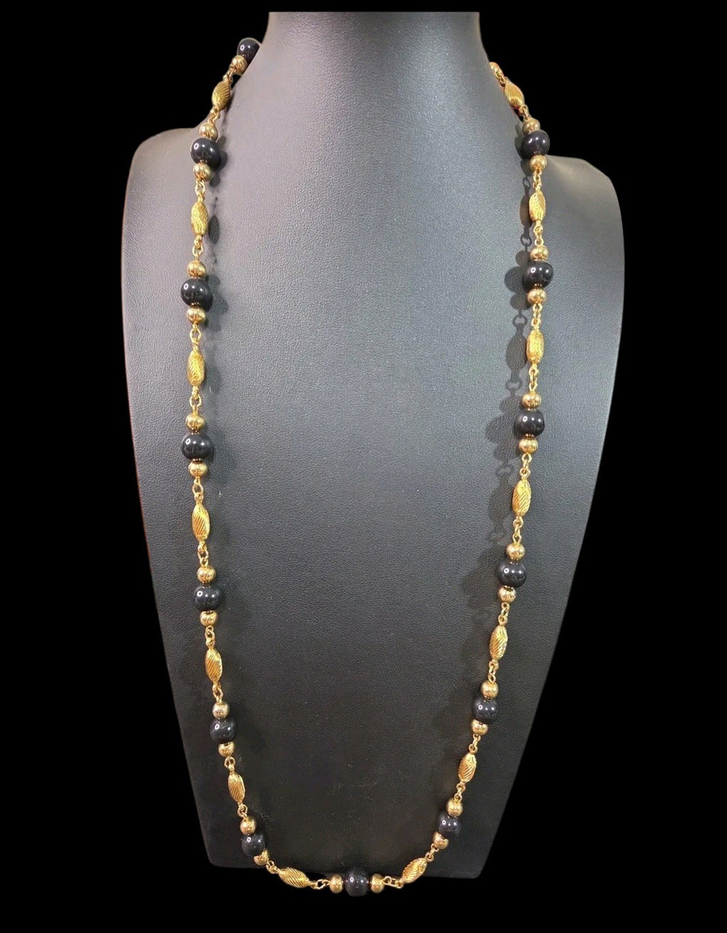 Oddly Darling Vintage long necklace with alternating polished black beads and textured gold-tone metal spacers