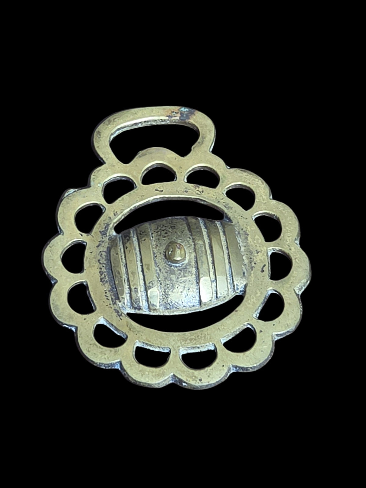 Oddly Darling Vintage brass horse harness medallion featuring a scalloped circular frame and central barrel motif.