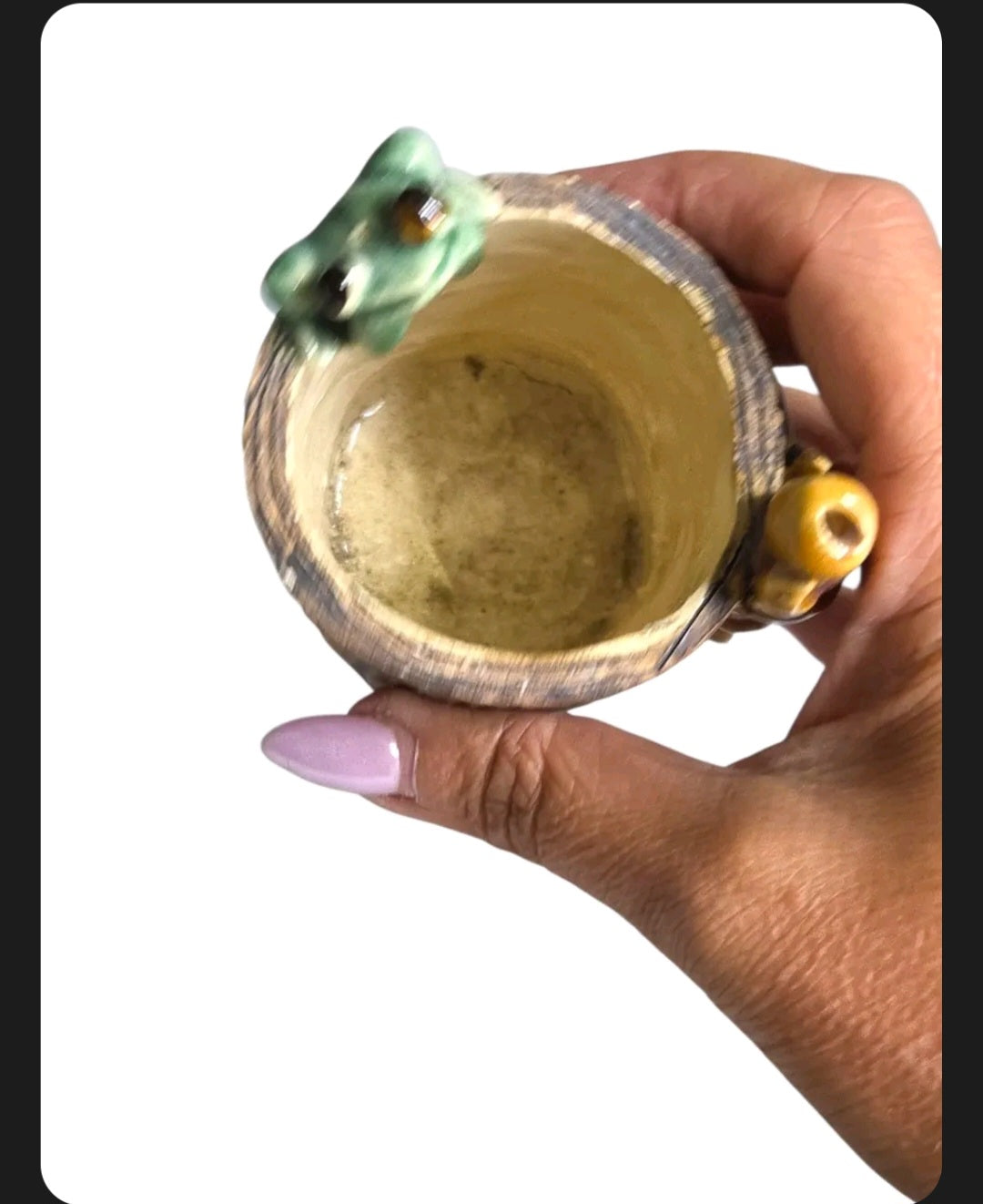 Oddly Darling Vintage handcrafted ceramic tree stump vessel with a green frog and bamboo accent held in a hand