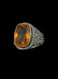 Oddly Darling Vintage statement ring featuring a large cushion-cut citrine in an ornate sterling silver band.