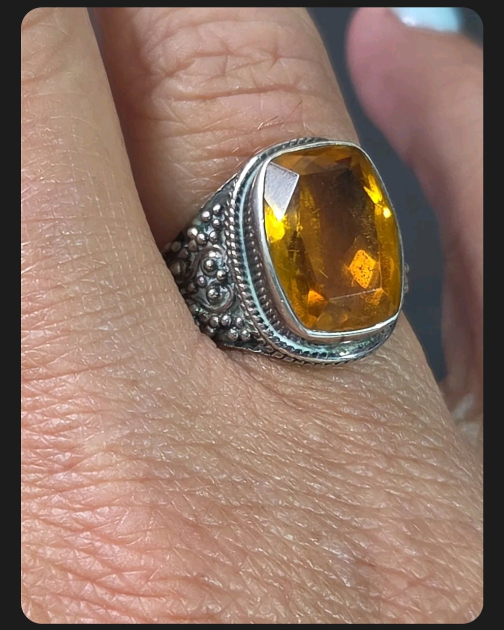 Oddly Darling Vintage ornate sterling silver statement ring featuring a large cushion-cut golden citrine gemstone.