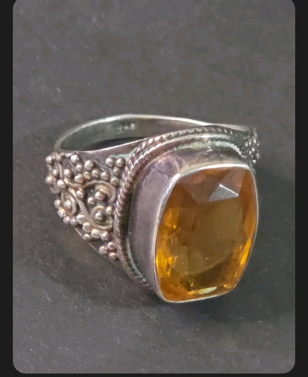 Oddly Darling Vintage ornate sterling silver statement ring featuring a large cushion-cut golden citrine gemstone.