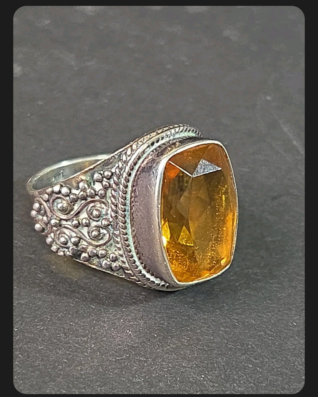 Oddly Darling Vintage ornate sterling silver statement ring featuring a large cushion-cut golden citrine gemstone.