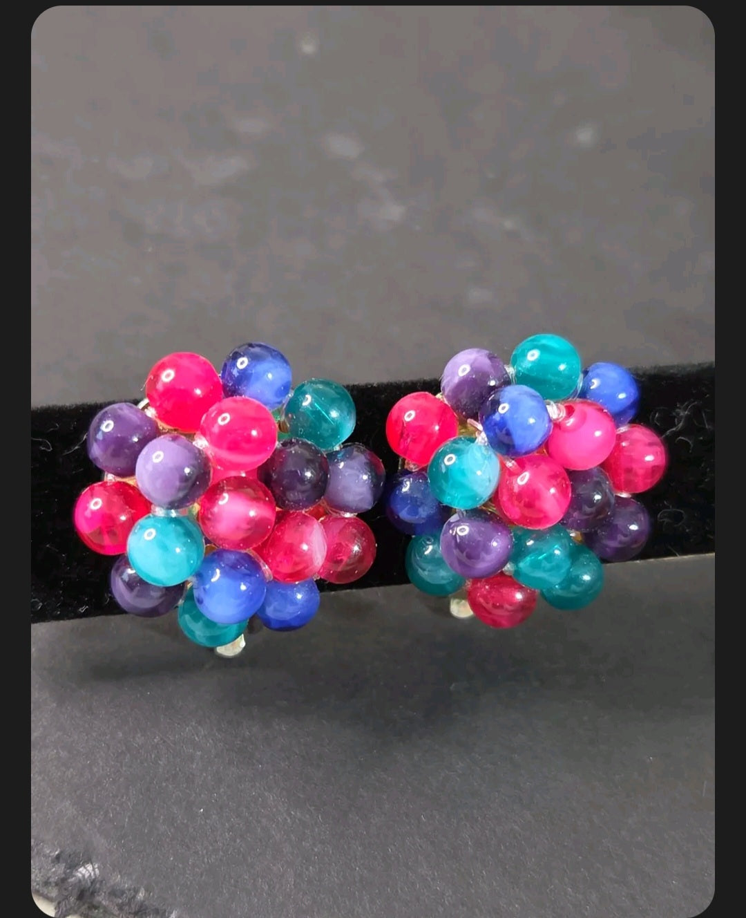 Oddly Darling Vintage multi-colored cluster bead clip-on earrings with magenta, teal, blue, and purple spheres.