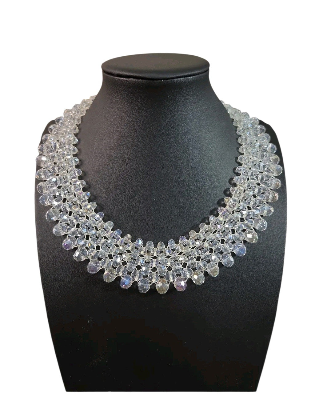 Oddly Darling Vintage handcrafted crystal statement collar necklace with multi-layered faceted clear beads on a display