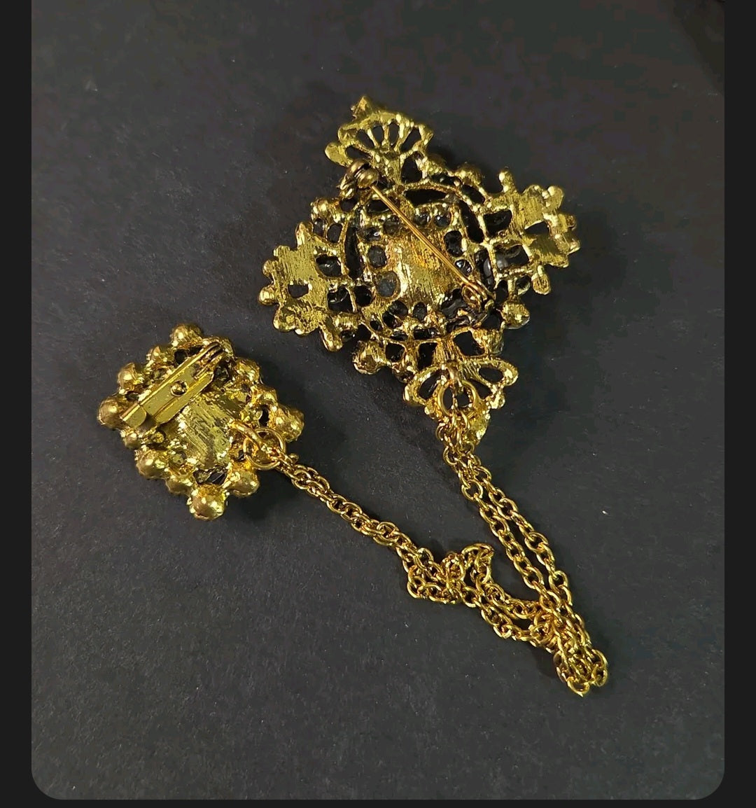 Oddly Darling Vintage ornate double brooch set with gold-tone chain, showing the back view with secure pin closures.