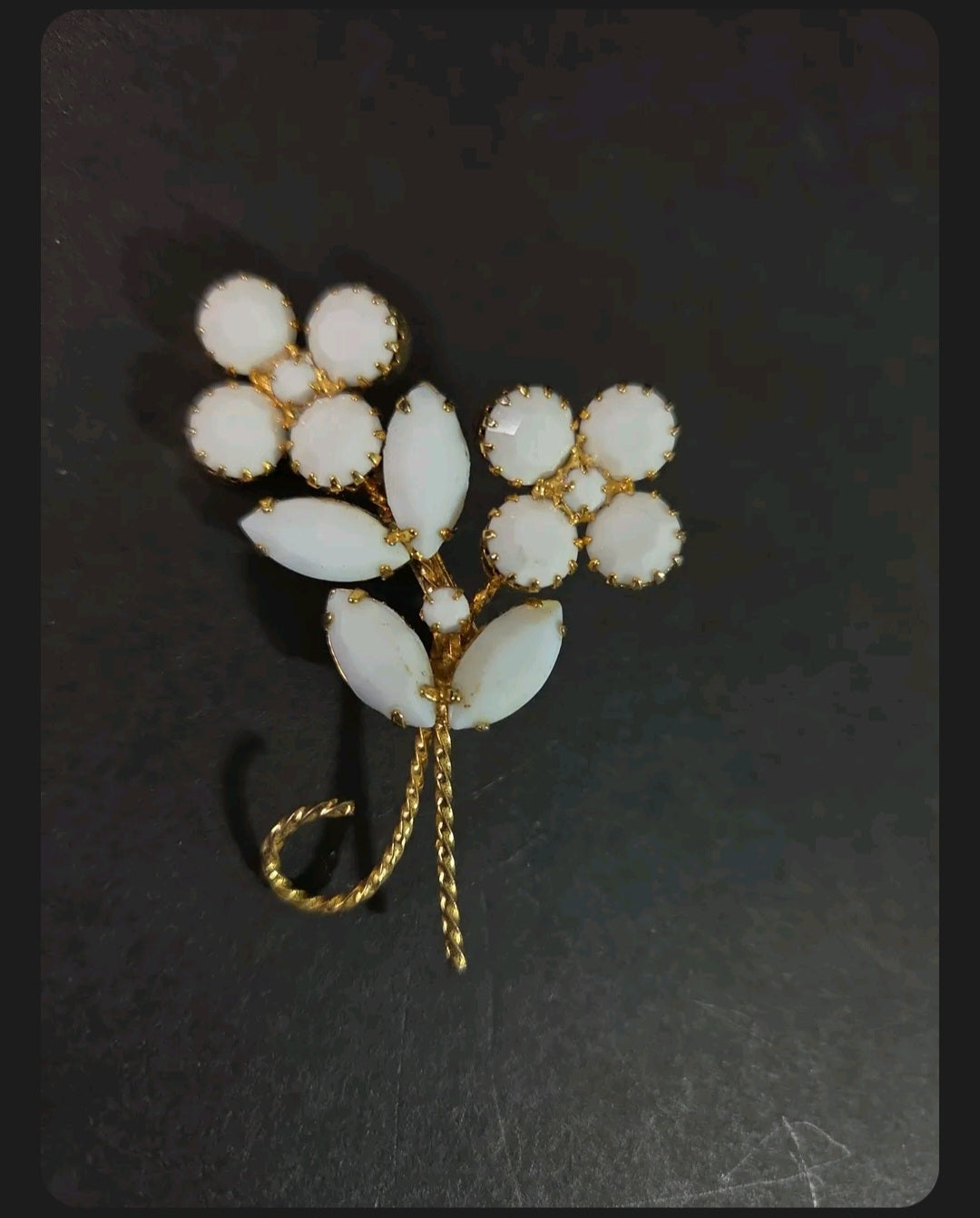 Oddly Darling Vintage floral brooch with white cabochon flower clusters and gold-tone marquise leaf accents.