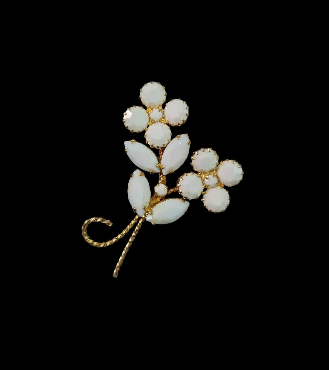 Oddly Darling Vintage floral brooch featuring white cabochon flower clusters and gold-tone marquise leaves.