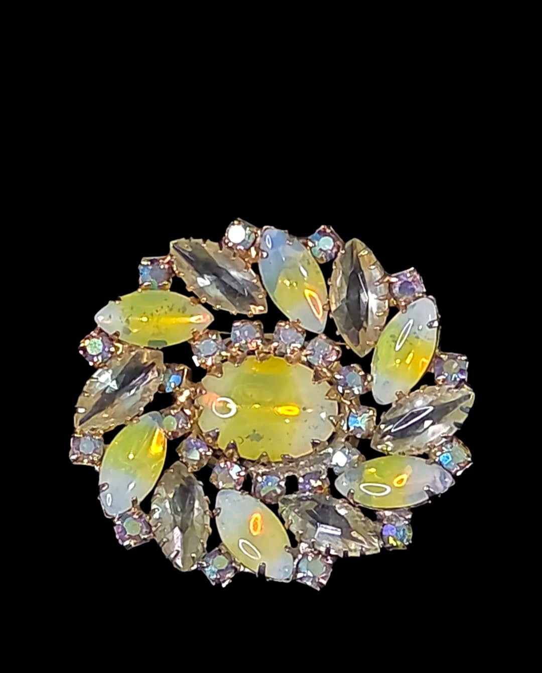 Oddly Darling Vintage floral brooch with a central oval cabochon, marquise-cut iridescent stones, and gold-tone base.