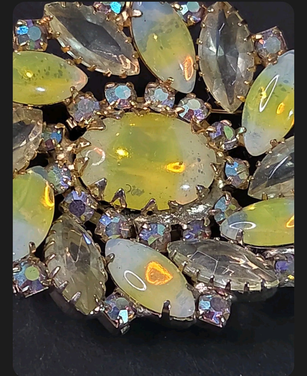 Oddly Darling Vintage floral brooch with iridescent oval cabochon and marquise-cut rhinestones in gold-tone setting.