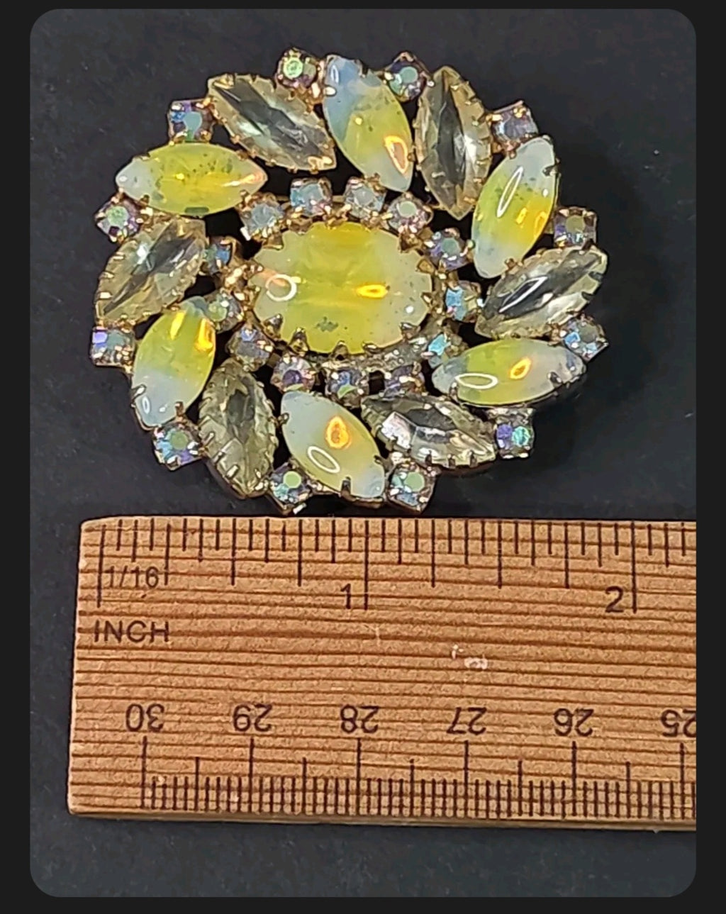 Oddly Darling Vintage floral brooch with iridescent marquise stones, central cabochon, and gold-tone setting.
