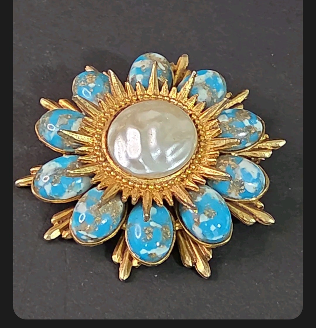 Oddly Darling Vintage floral statement brooch with a gold sunburst frame, turquoise marbled stones, and cabochon center.