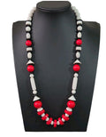 Oddly Darling Vintage geometric statement necklace featuring red, white, and black beads in sphere and disc shapes.