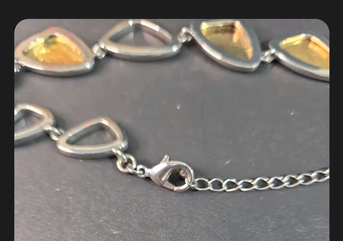 Oddly Darling Vintage mixed-metal statement necklace featuring silver-tone geometric links with gold-tone accents.