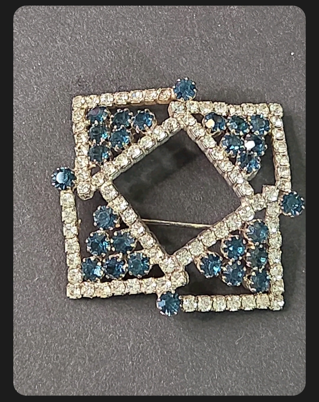 Oddly Darling Vintage geometric brooch with clear crystals and deep blue stones in a square-within-a-square design.