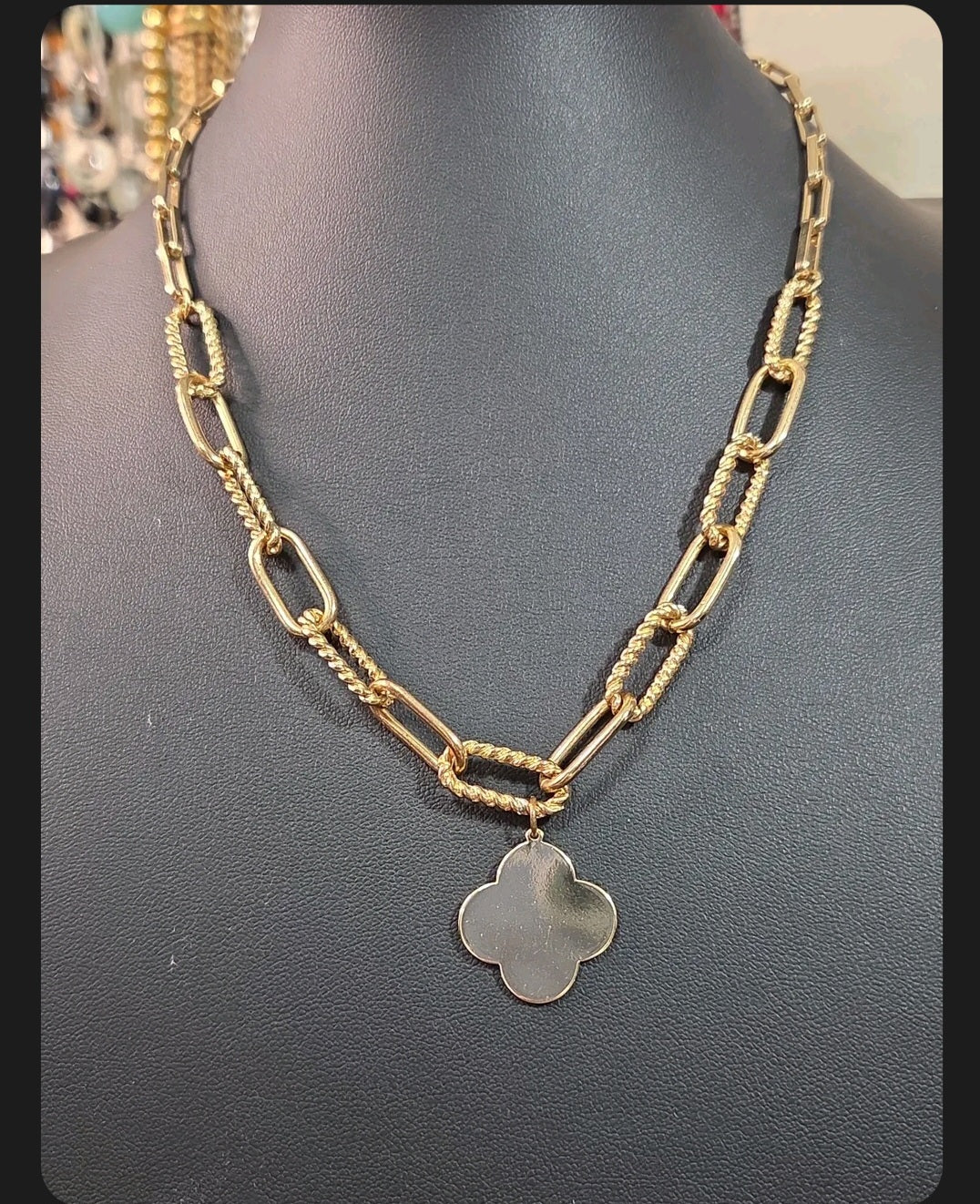 Oddly Darling Vintage gold-tone necklace featuring a polished clover charm on a textured mixed-link chain.