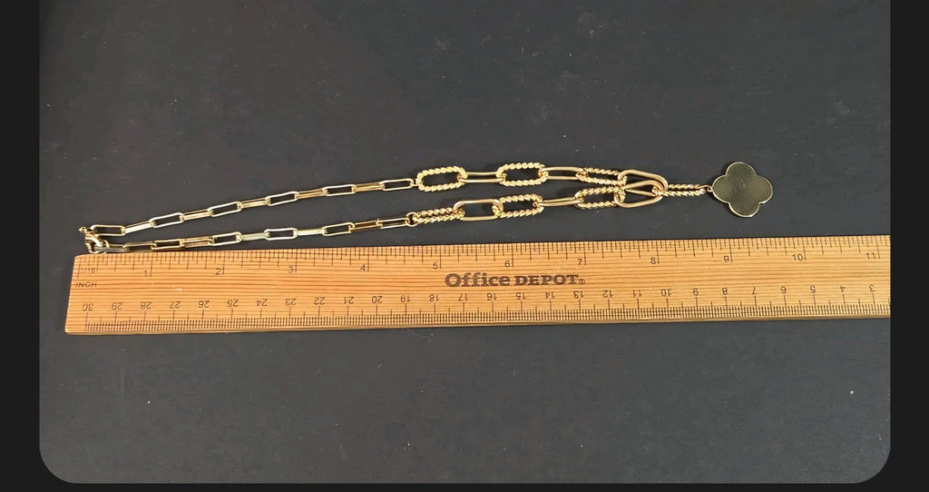 Oddly Darling Vintage gold-tone clover charm necklace with mixed rectangular and twisted rope links on a ruler