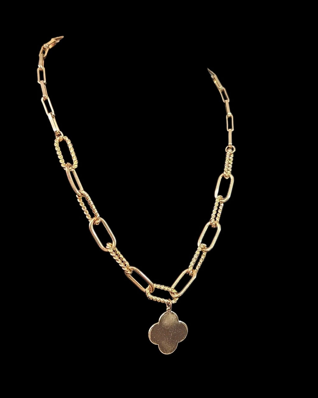Oddly Darling Vintage gold-tone necklace featuring a polished clover charm on a textured mixed-link chain.