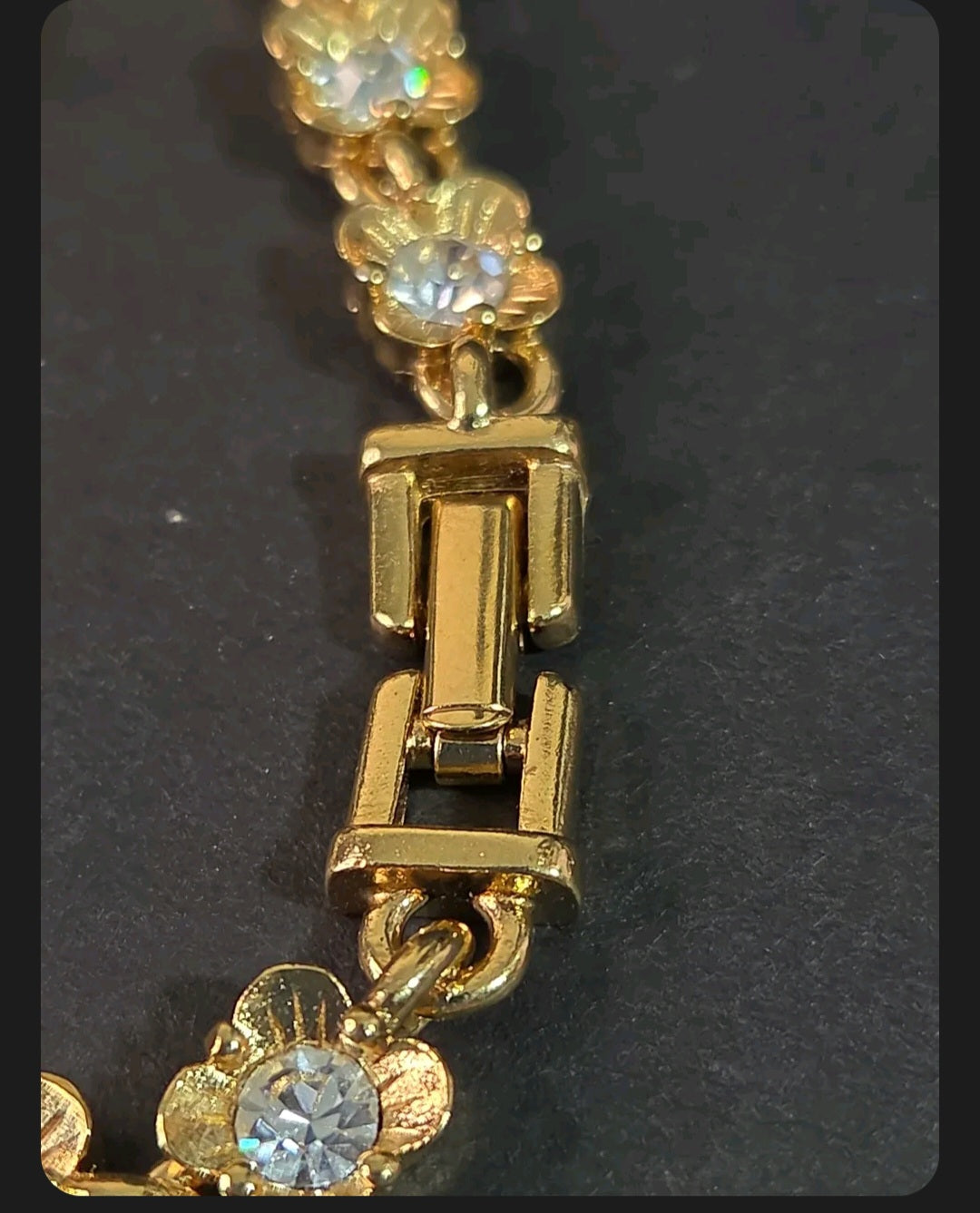 Oddly Darling Vintage gold-tone floral link bracelet featuring clear crystal centers and a secure fold-over clasp.