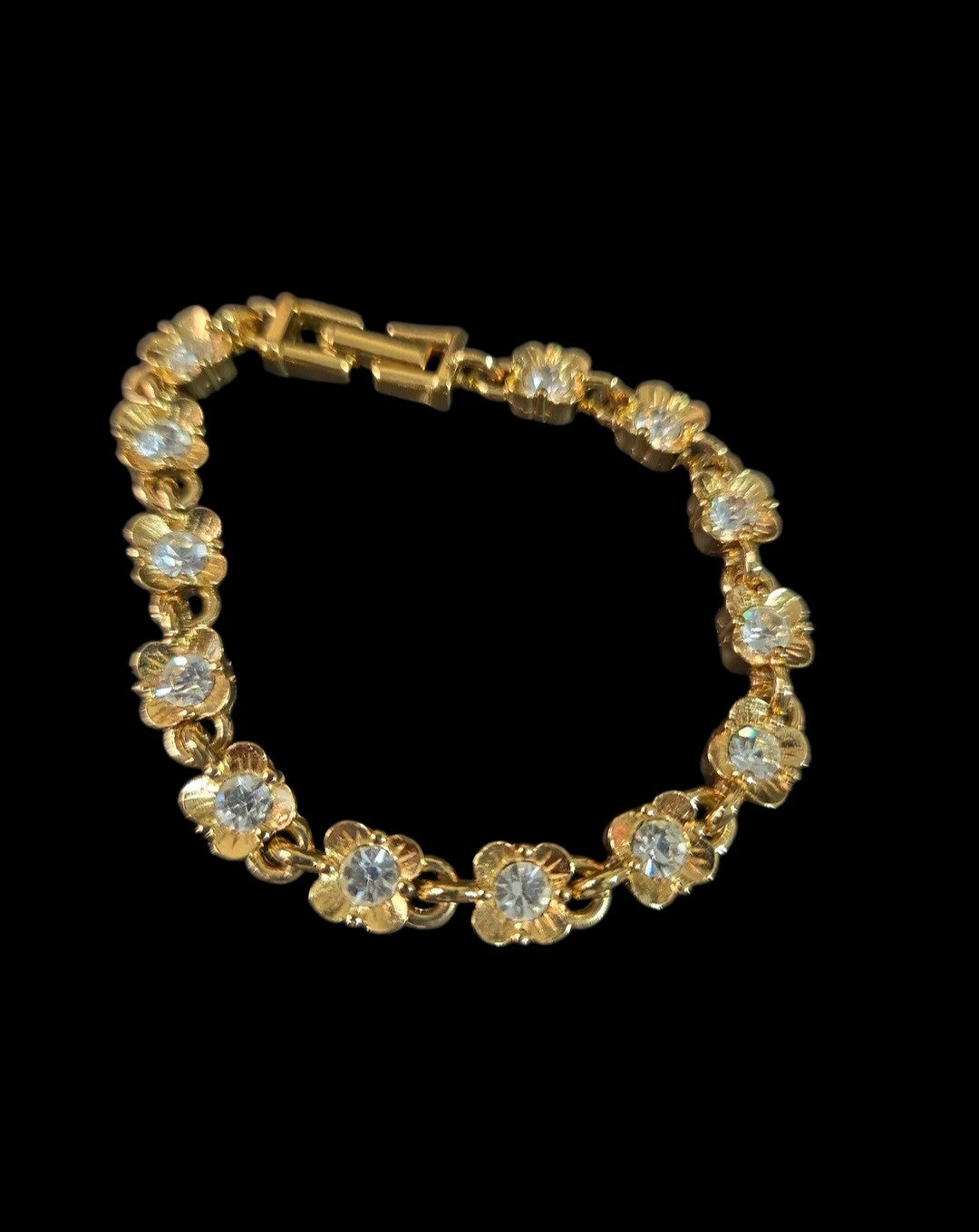 Oddly Darling Vintage gold-tone floral link bracelet featuring sparkling clear crystal centers and a fold-over clasp.