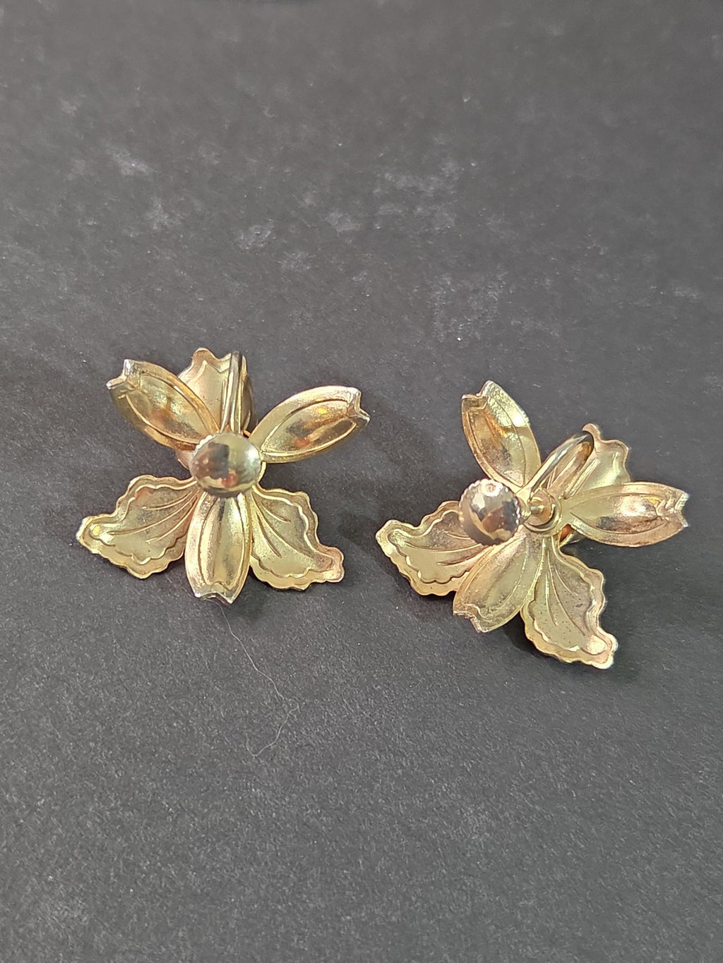 Oddly Darling Vintage floral screw-back earrings in gold-tone metal with a blooming orchid design.