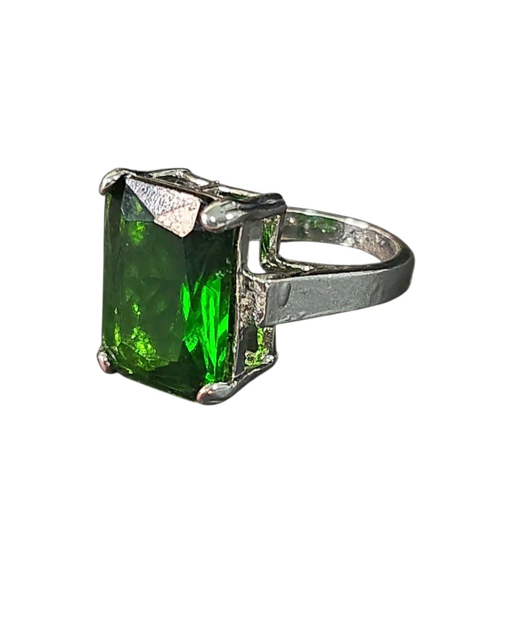 Oddly Darling Vintage statement ring featuring a large emerald-cut green gemstone in a polished silver-tone setting.