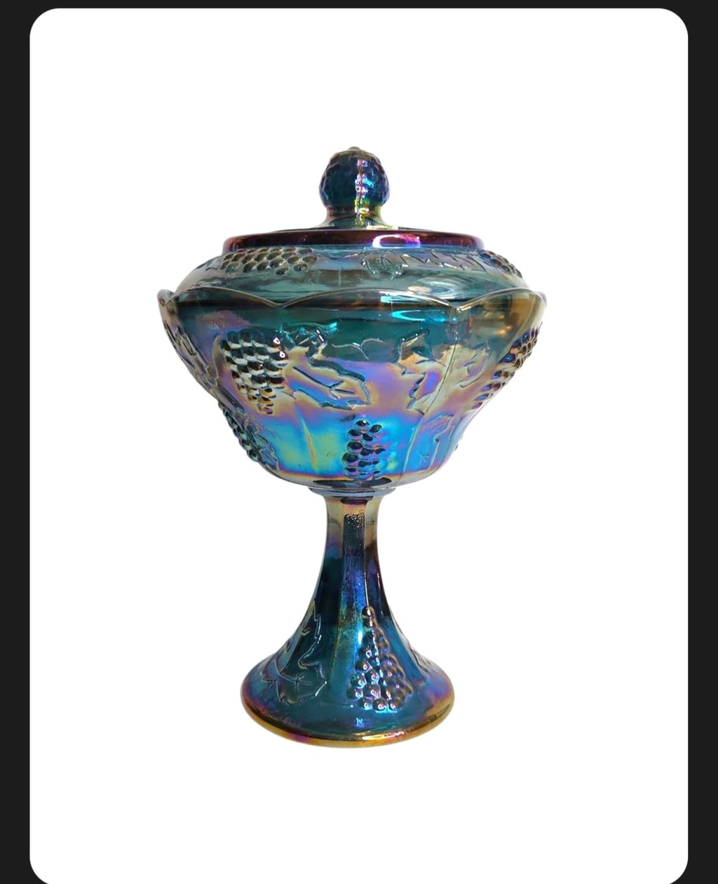 Oddly Darling Vintage iridescent blue carnival glass pedestal candy dish with embossed grape and vine motif and lid.