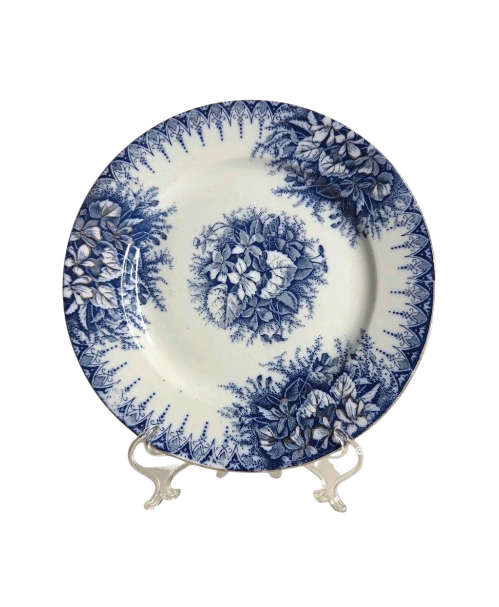 Oddly Darling Vintage Lunéville ceramic plate featuring a blue floral transferware pattern on an off-white background.