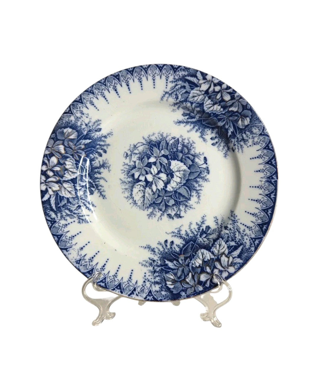 Oddly Darling Vintage Lunéville ceramic plate featuring a blue floral transferware pattern on an off-white background.