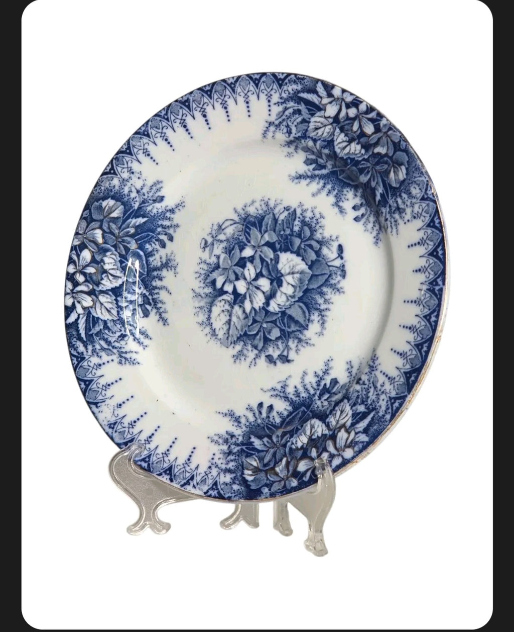 Oddly Darling Vintage Lunéville ceramic plate featuring a blue floral transferware pattern on an off-white background.