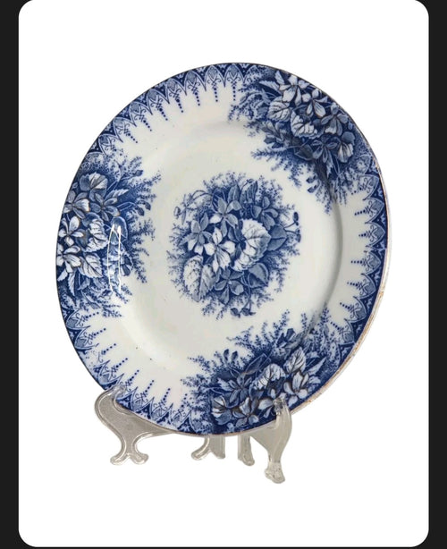 Oddly Darling Vintage Lunéville ceramic plate featuring a blue floral transferware pattern on an off-white background.
