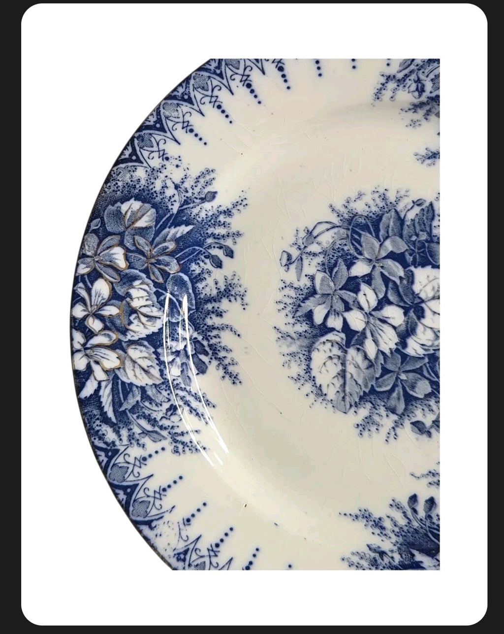 Oddly Darling Vintage Lunéville ceramic plate featuring a blue floral transferware pattern on off-white with crazing.
