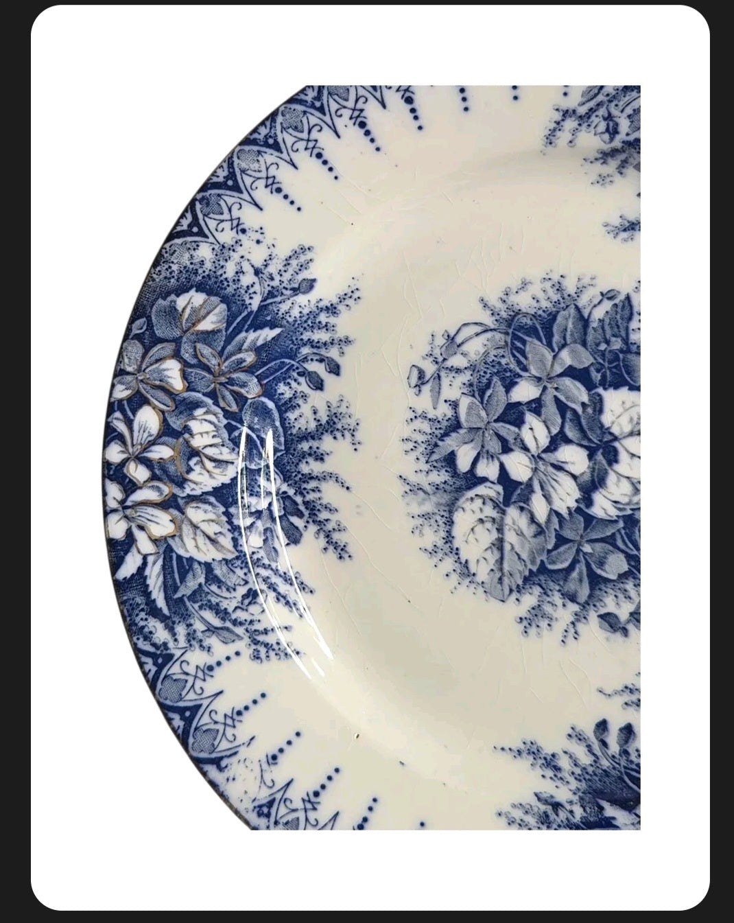 Oddly Darling Vintage Lunéville ceramic plate featuring a blue floral transferware pattern on off-white with crazing.