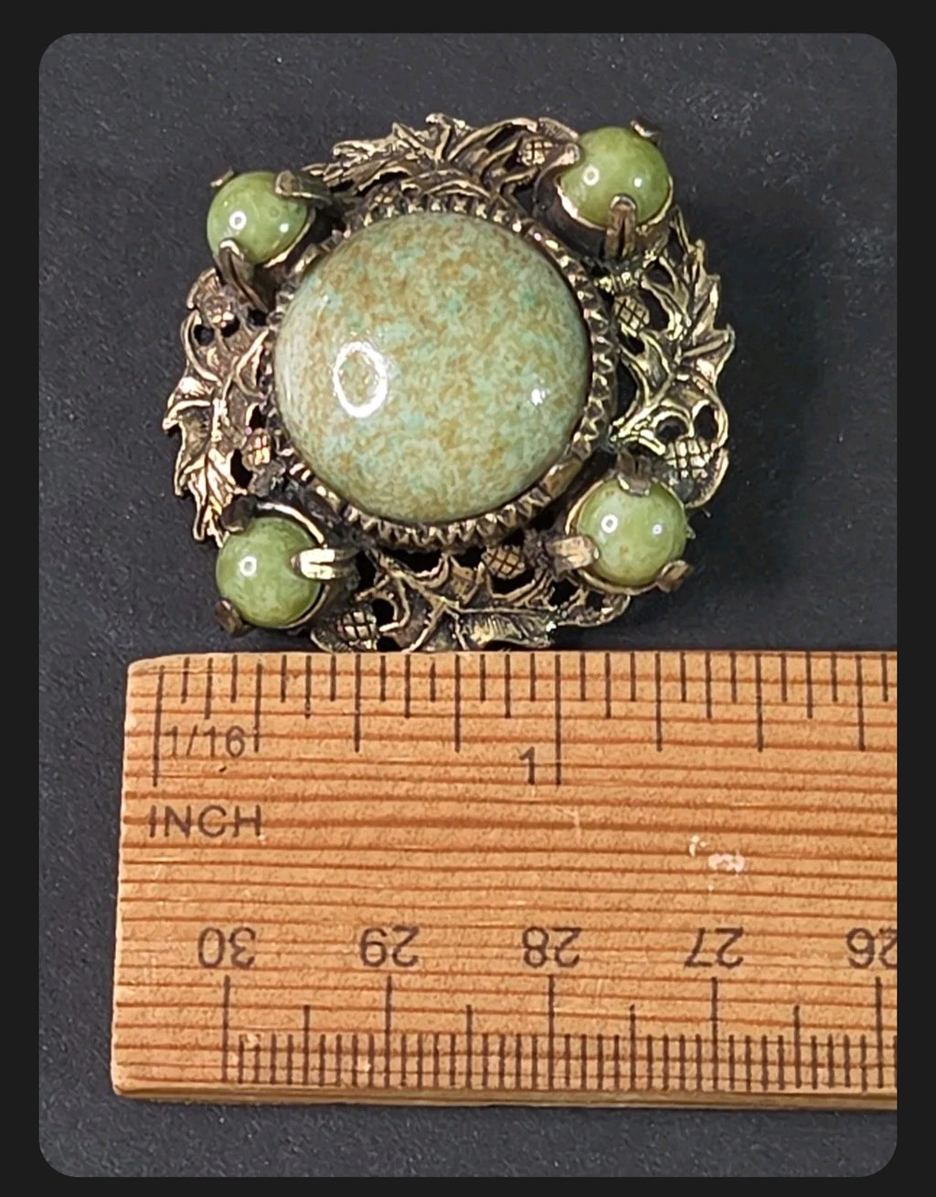 Oddly Darling Vintage Miracle brooch with sage green cabochon stones and antique gold leaf and acorn metal filigree.