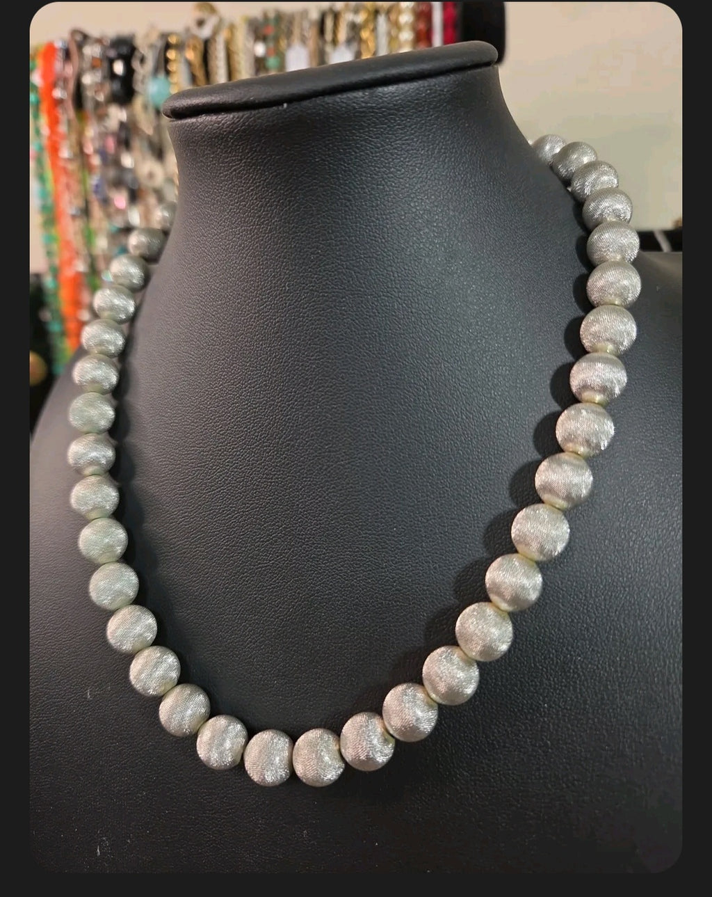 Oddly Darling Vintage Monet statement necklace featuring silver-tone spherical beads with a textured brushed finish.