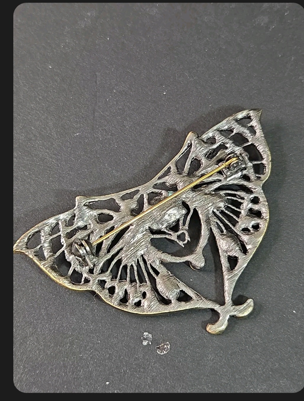 Oddly Darling Vintage ornate moth brooch back view showing the antique bronze metalwork and secure pin closure.