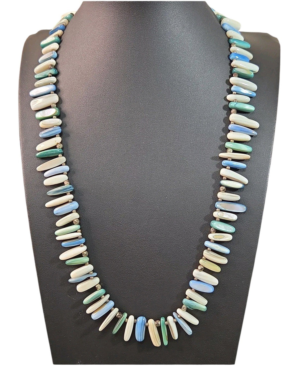 Oddly Darling Vintage multi-colored shell bead necklace with blue, green, and white elongated beads on a display bust.