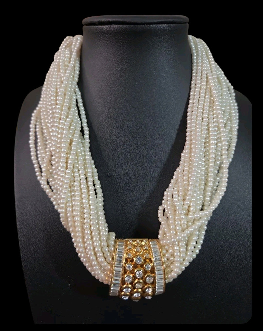 Oddly Darling Vintage multi-strand cream faux pearl necklace with a gold-tone rhinestone and crystal centerpiece.