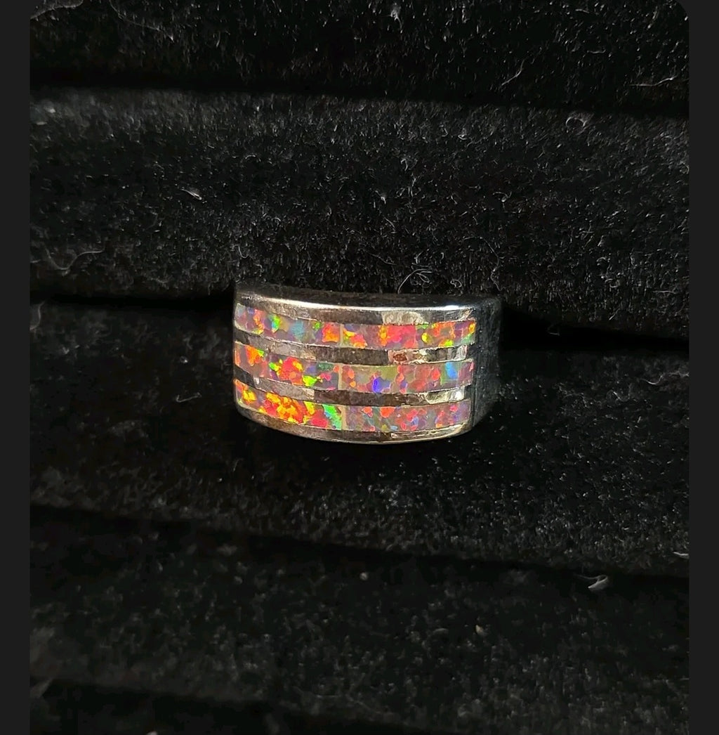 Oddly Darling Vintage wide band ring featuring three horizontal channels of iridescent multi-colored opal inlay.