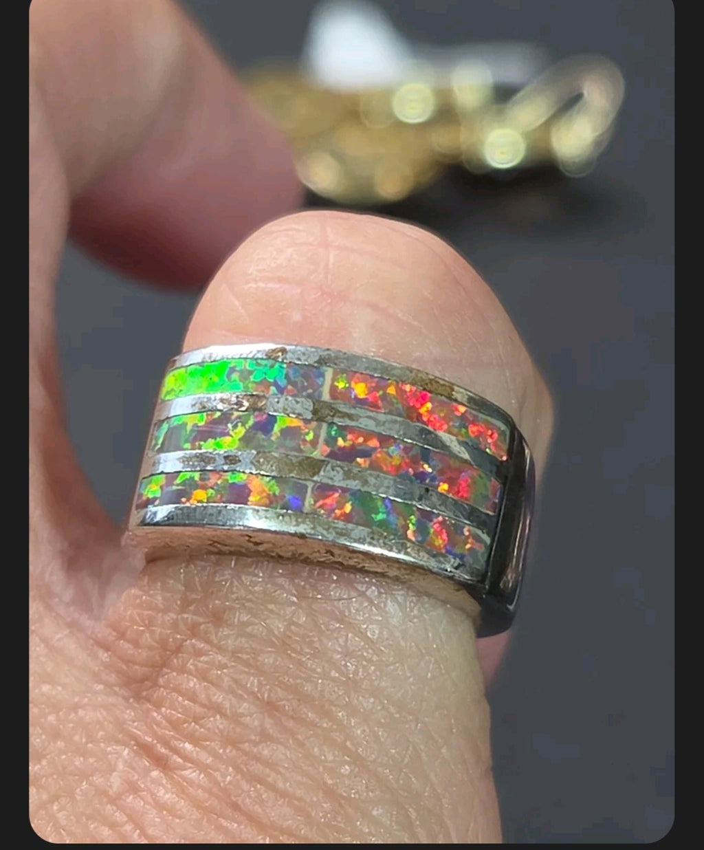 Oddly Darling Vintage wide band ring featuring three horizontal channels of iridescent multi-colored opal inlay