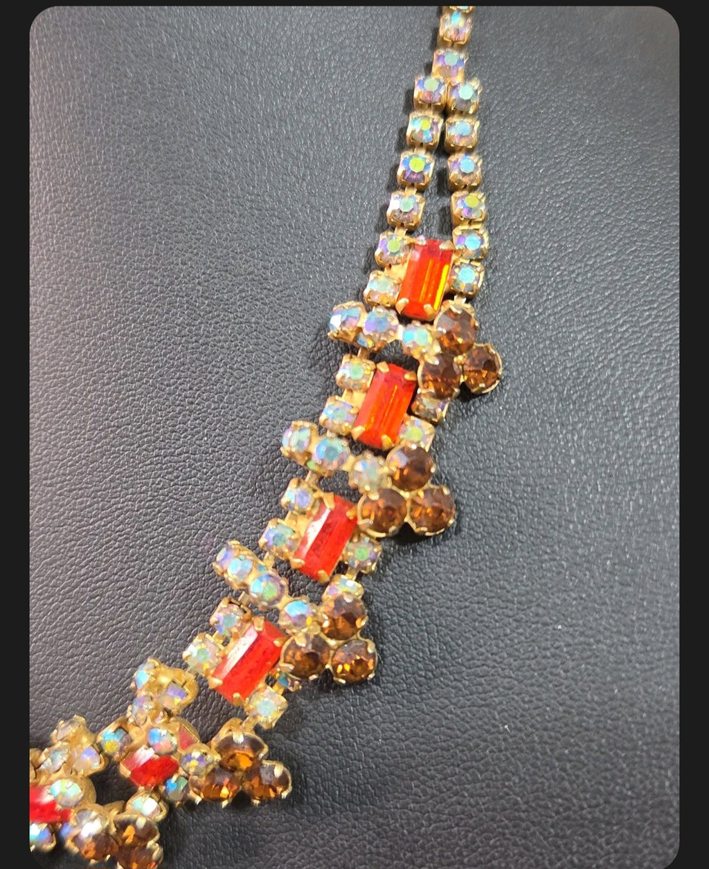 Oddly Darling Vintage statement necklace with orange rectangular crystals, amber stones, and iridescent accents.