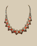 Oddly Darling Vintage collar necklace featuring orange and amber crystals with iridescent accents in a gold-tone setting