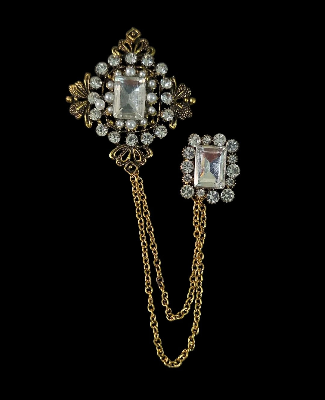 Oddly Darling Vintage ornate double brooch set with gold-tone chains, clear crystals, and faux pearls on black.