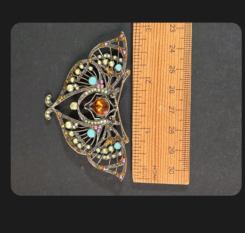 Oddly Darling Vintage ornate moth brooch in antique bronze with amber stone and turquoise, yellow, and orange crystals.
