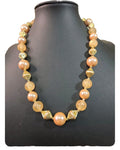 Oddly Darling Vintage statement necklace with peach faux pearls, frosted beads, and gold-tone fluted spacers.