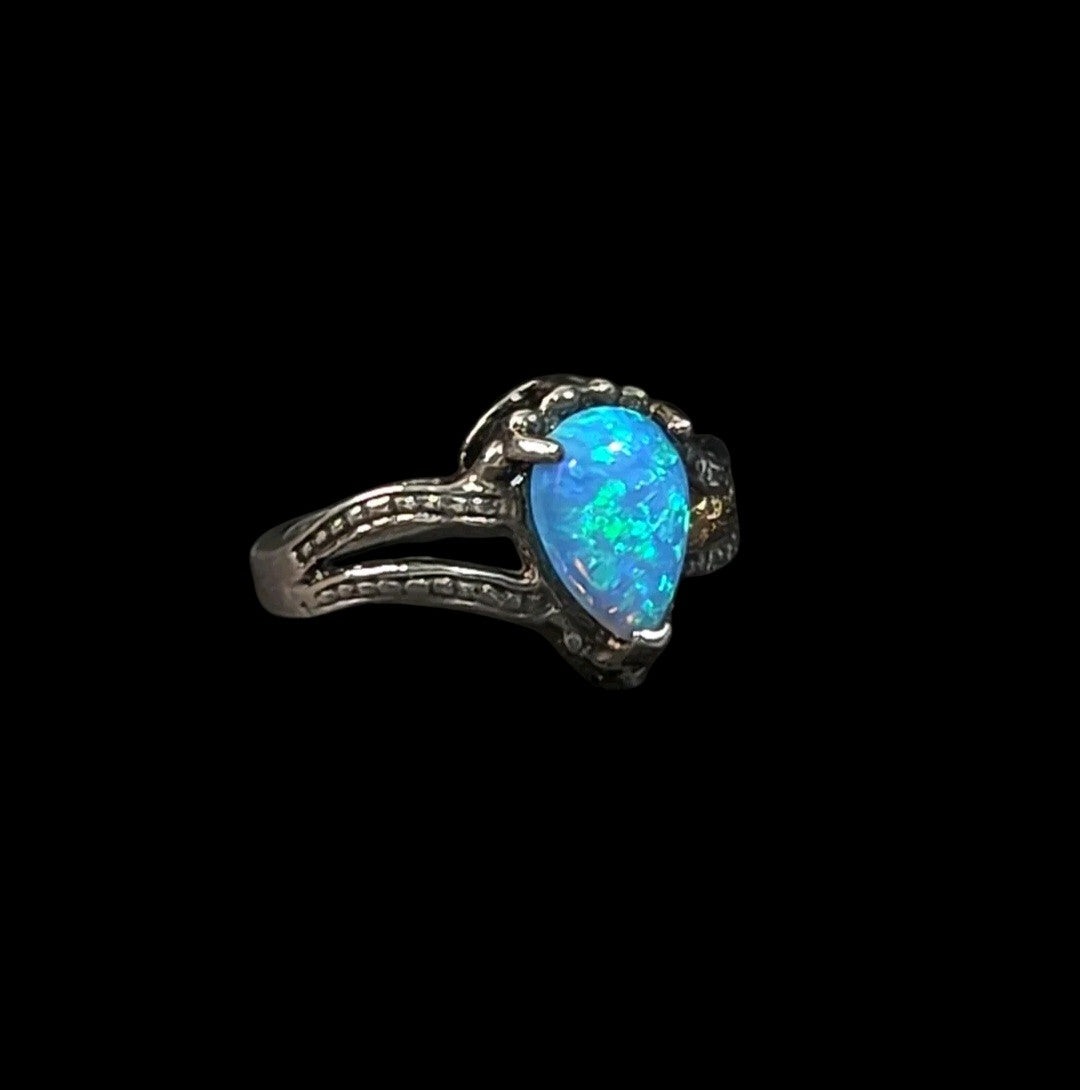 Oddly Darling Vintage pear-shaped blue opal statement ring with a textured silver-tone split-shank band.