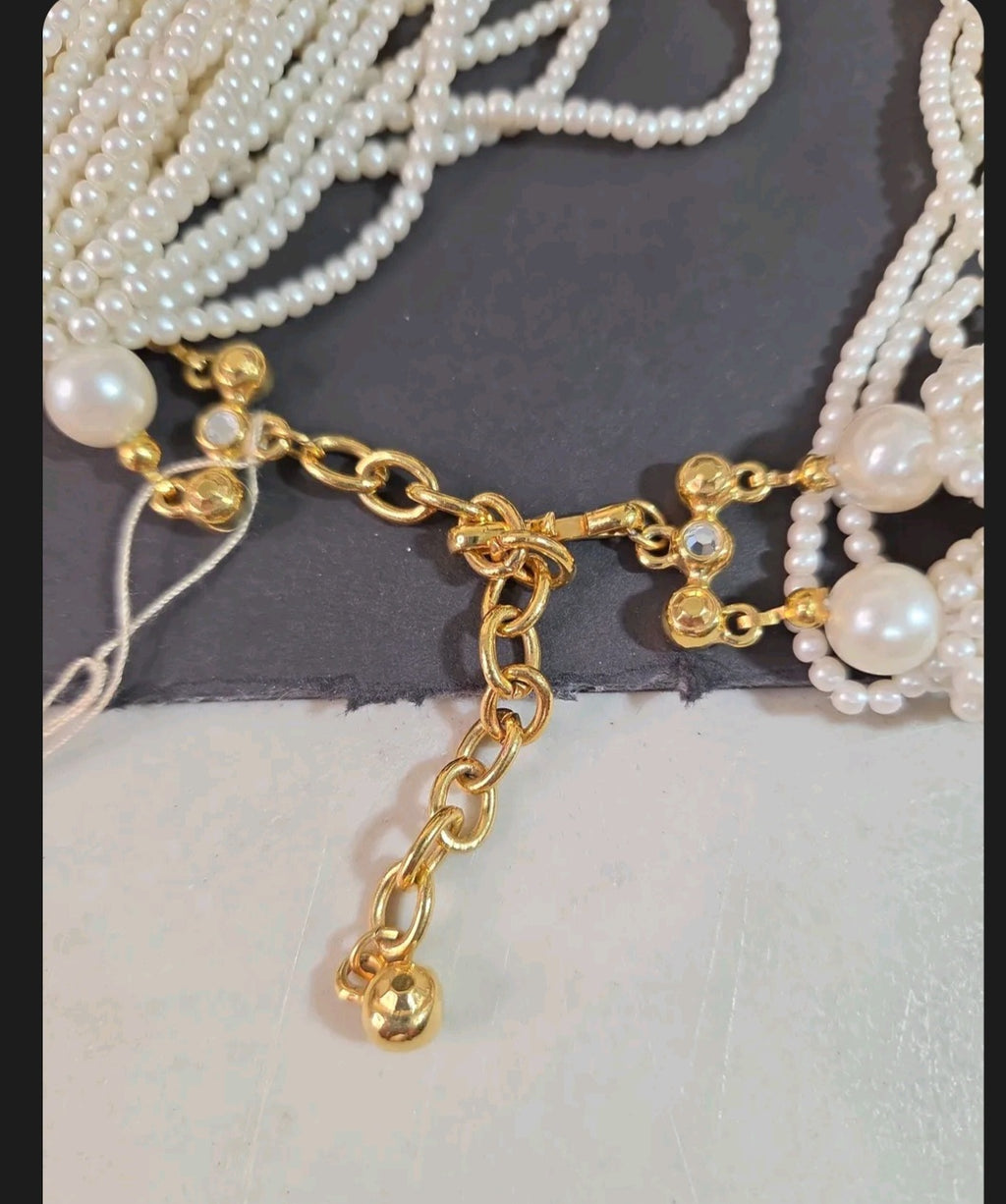 Oddly Darling Vintage multi-strand faux pearl necklace with gold-tone adjustable chain and rhinestone clasp detail